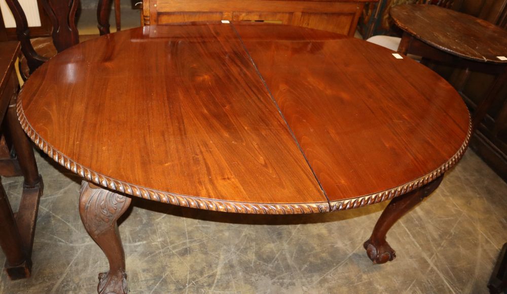 A 1920s Chippendale revival mahogany extending dining table, 210cm extended (two leaves and winder)